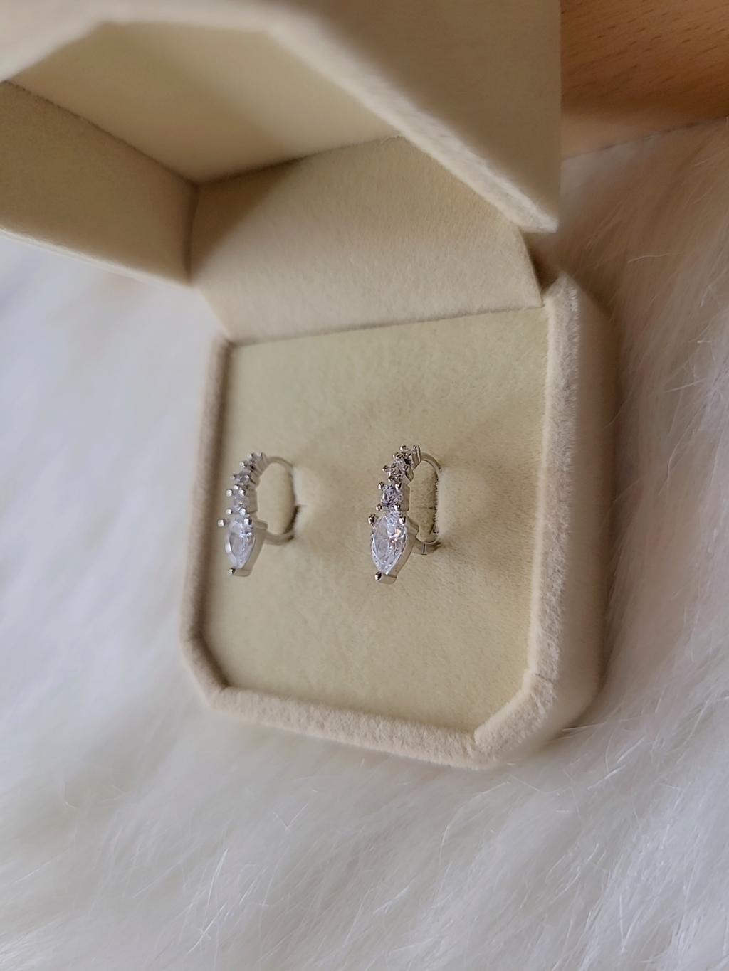 SilverBloom 925 Sterling Silver Teardrop CZ Huggie Earrings