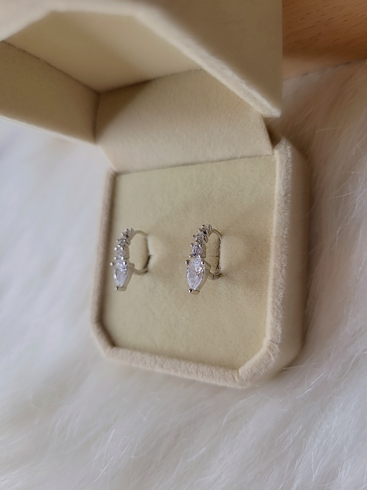 SilverBloom 925 Sterling Silver Teardrop CZ Huggie Earrings