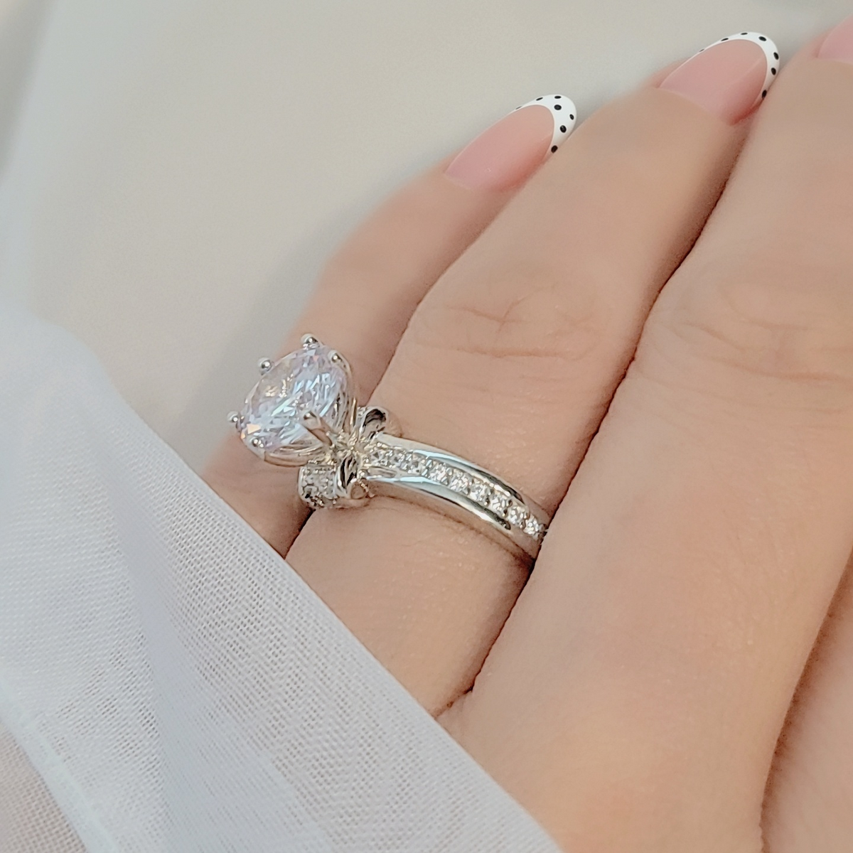 SilverBloom 925 Women's Round Cut Cubic Zirconia Solitaire Ring with Pavé Band – Size 7