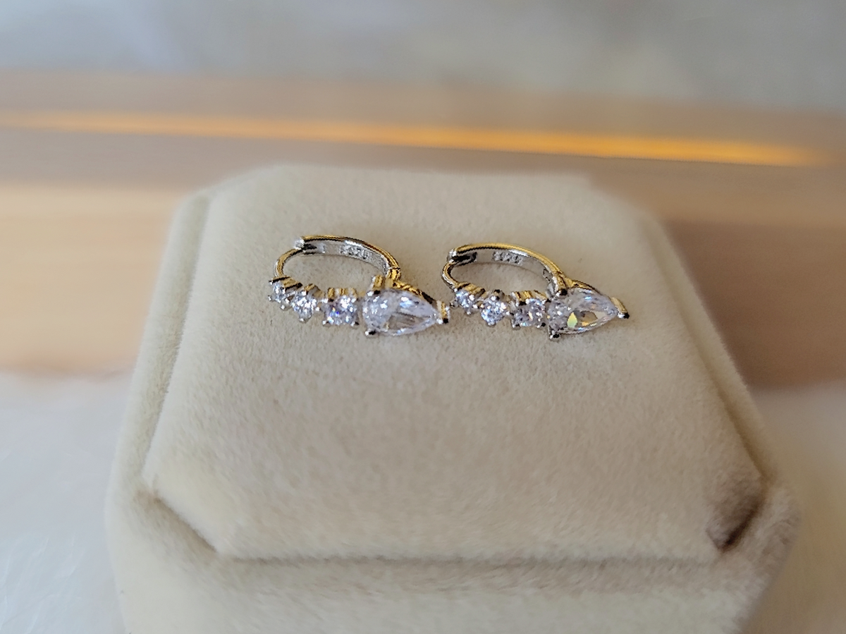 SilverBloom 925 Sterling Silver Teardrop CZ Huggie Earrings
