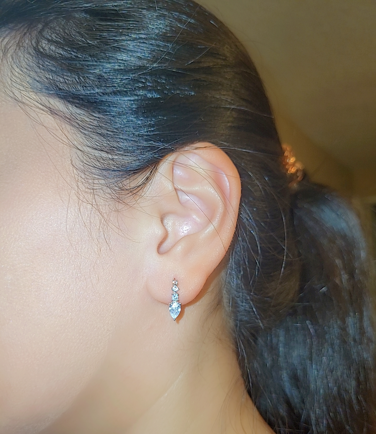 SilverBloom 925 Sterling Silver Teardrop CZ Huggie Earrings